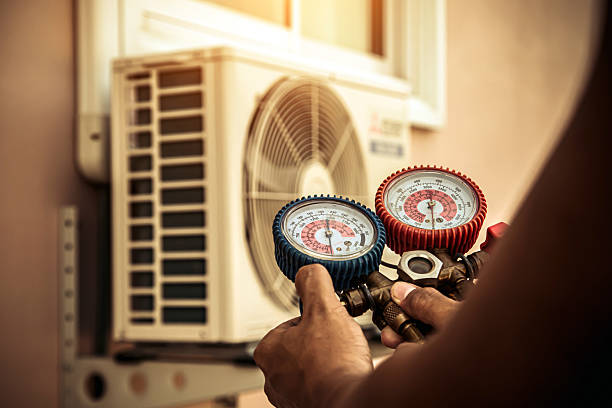Professional Air Conditioning Service technician working in Rhome, TX